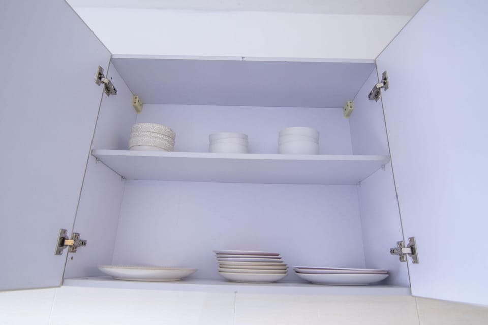 Full-size fridge, electric kettle, dining tables