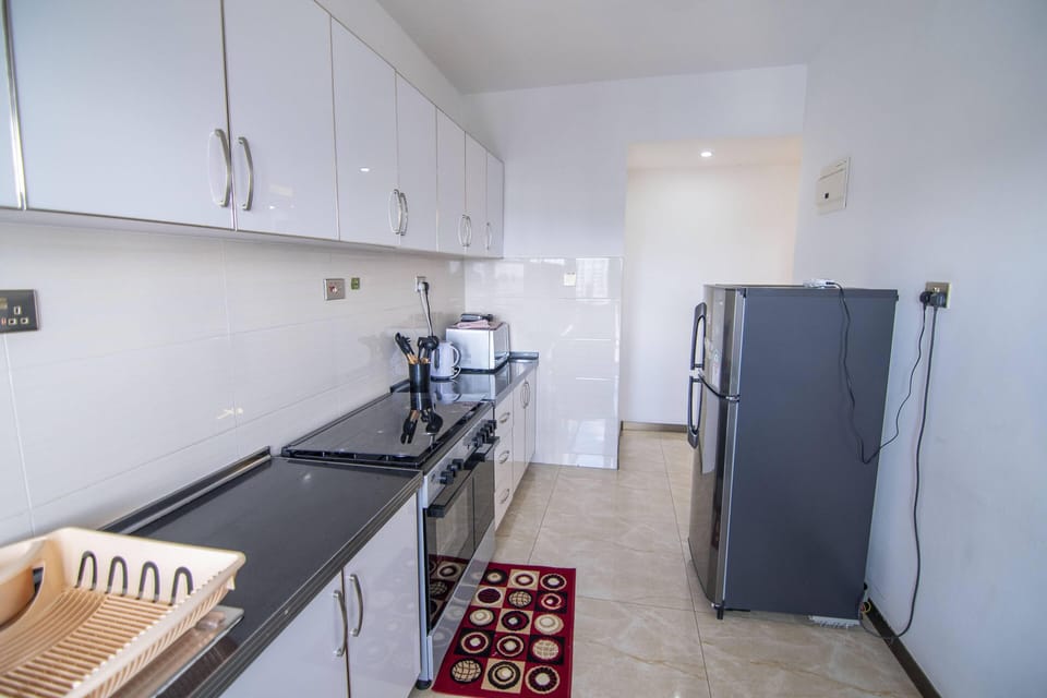 Classic Apartment | Private kitchen | Full-size fridge, electric kettle, dining tables