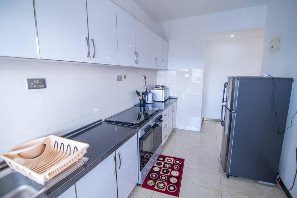 Classic Apartment | Private kitchen | Full-size fridge, electric kettle, dining tables