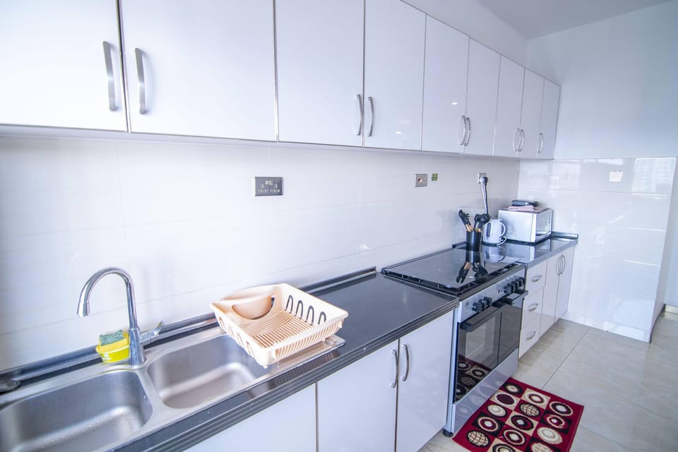 Full-size fridge, electric kettle, dining tables