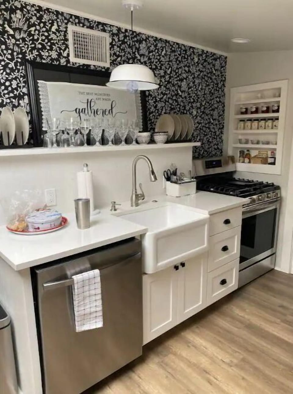 The fully stocked kitchen includes a dishwasher. gas stove and microwave.