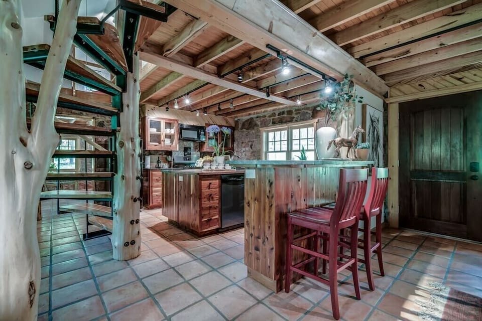 Feel the hand craftsmanship of the cedar post and beams which were taken directly off the property, The Gate House is a piece of living history with this land. Do you feel the connection? 