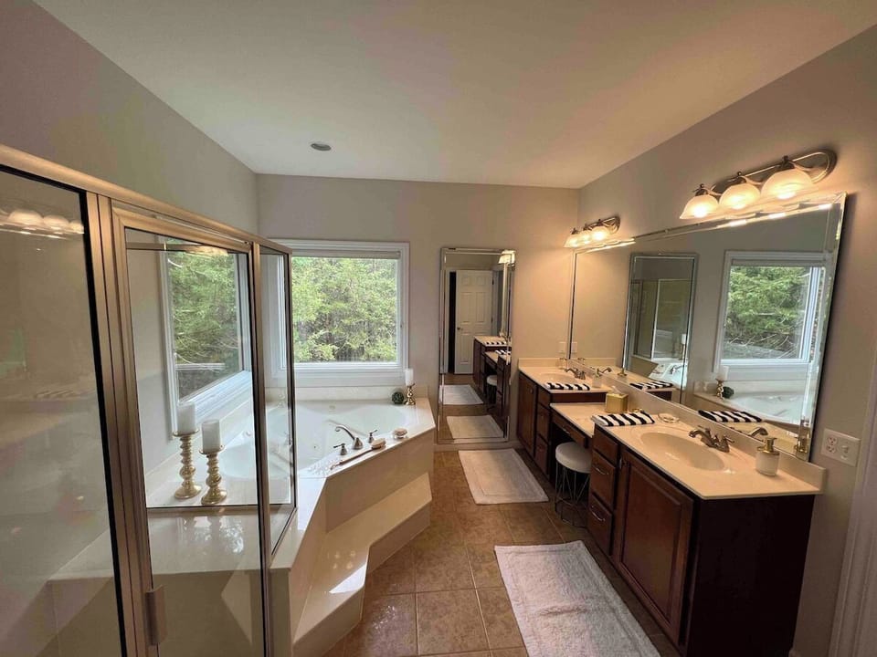 Master Bedroom #1.  On suite bathroom with jacuzzi tub, spacious shower, and double sinks.