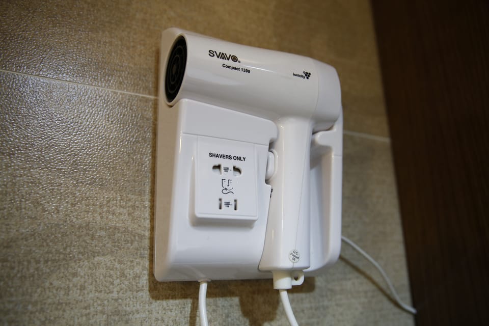Shower, free toiletries, hair dryer, slippers