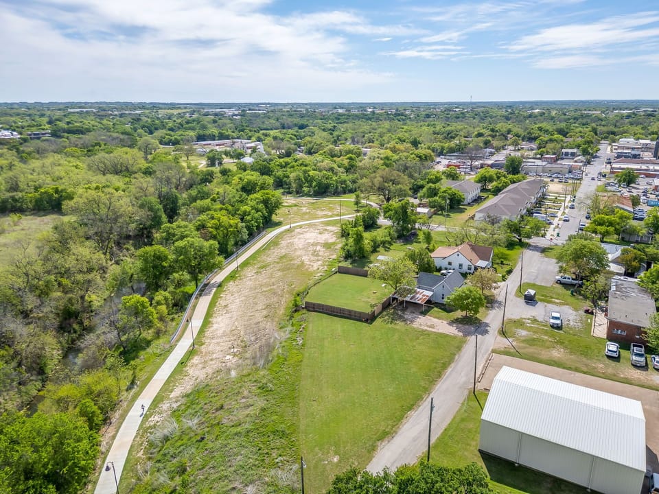 The Bosque River Trail runs right behind the property — step out the back gate and you're on one of Stephenville's best walking and biking trails.