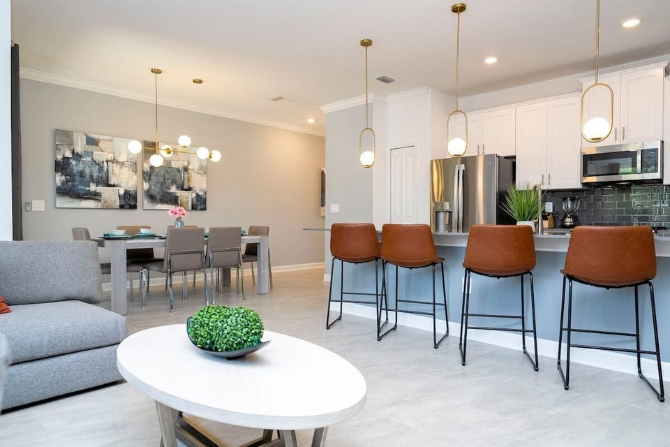The fully equipped kitchen features modern appliances, sleek cabinetry, and all essential cookware and utensils, making it perfect for preparing meals with ease.