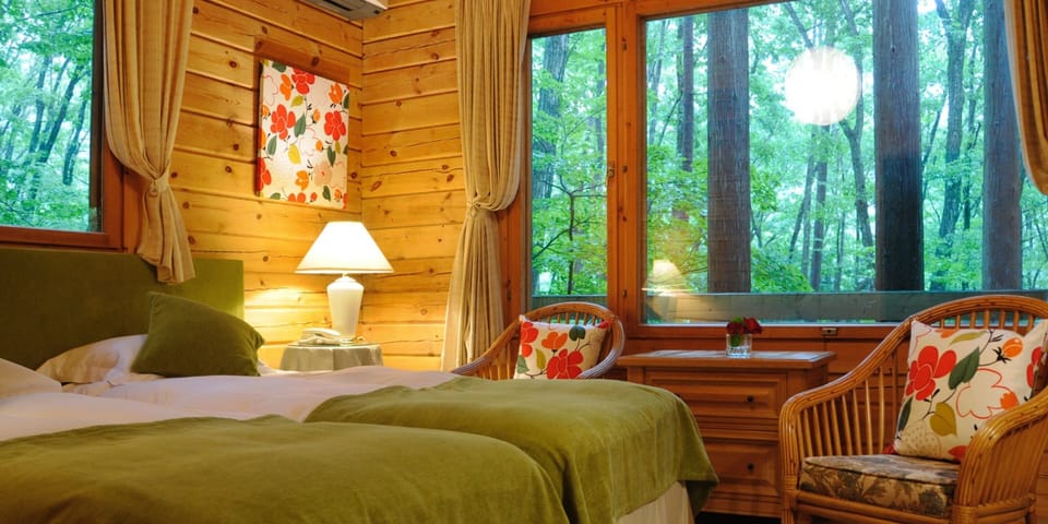 Log Cottage | Down comforters, minibar, desk, iron/ironing board (on request)