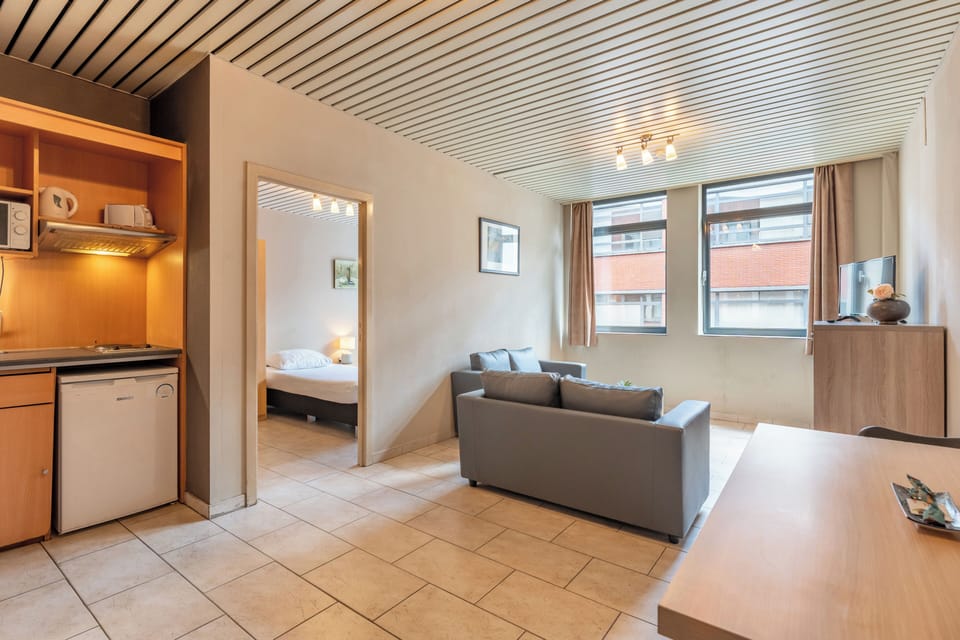 Apartment, 1 Bedroom | Living area | TV