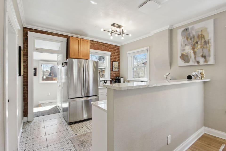 Newly remodeled kitchen with granite countertops, stainless steel appliances
