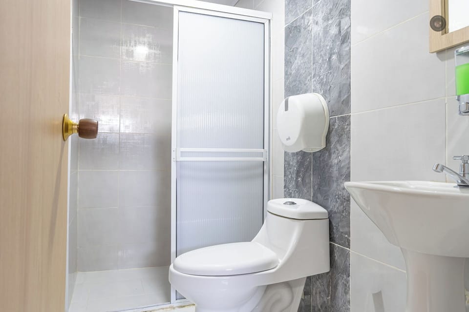 Shower, rainfall showerhead, towels, soap