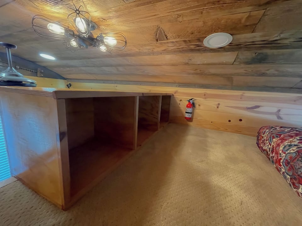 Storage inside the loft of the tiny home.