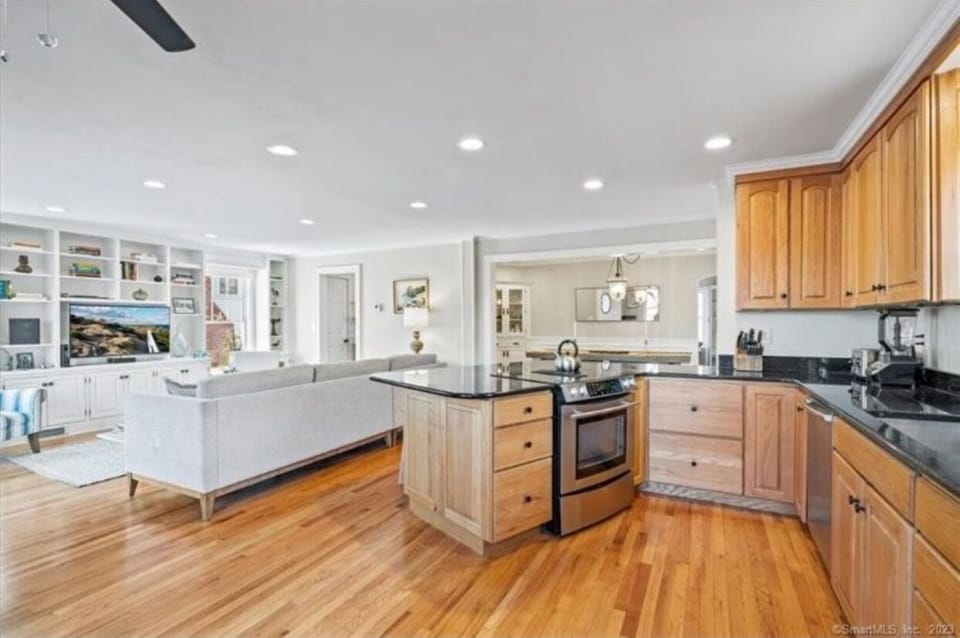 Open kitchen plan into the family room. New photos w/ update white cabinets t/c.