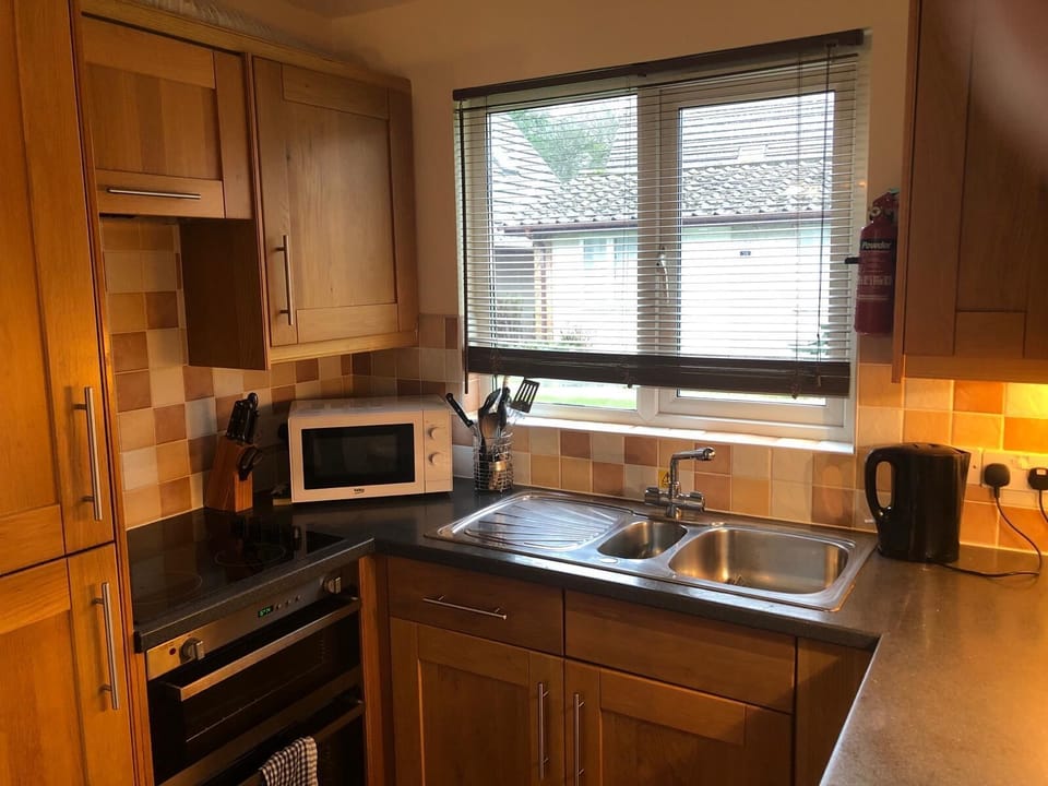 Microwave, hob, double oven and integrated fridge/freezer
