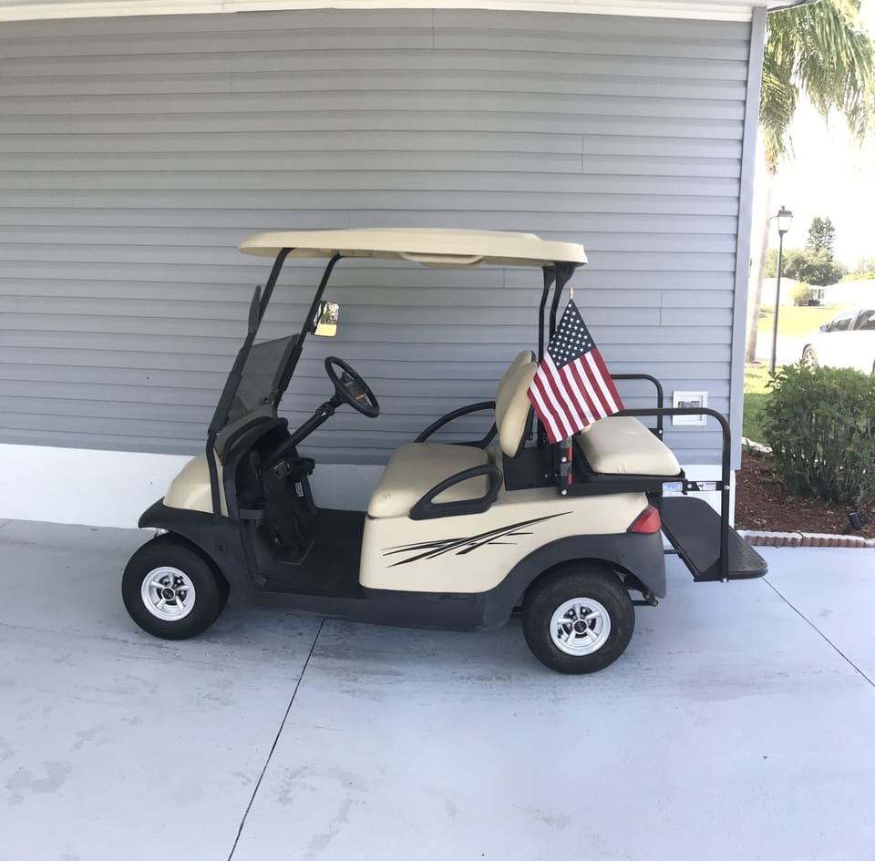 Four person golf cart with seat belts for our guests usage