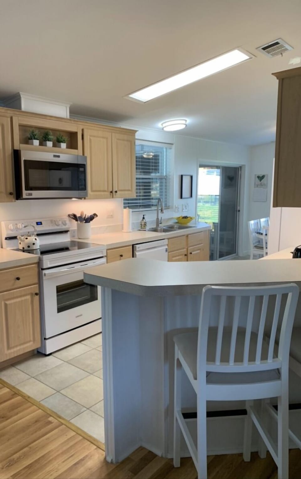 Galley kitchen fully stocked with cookware/spices/Keurig/utensils/paper products