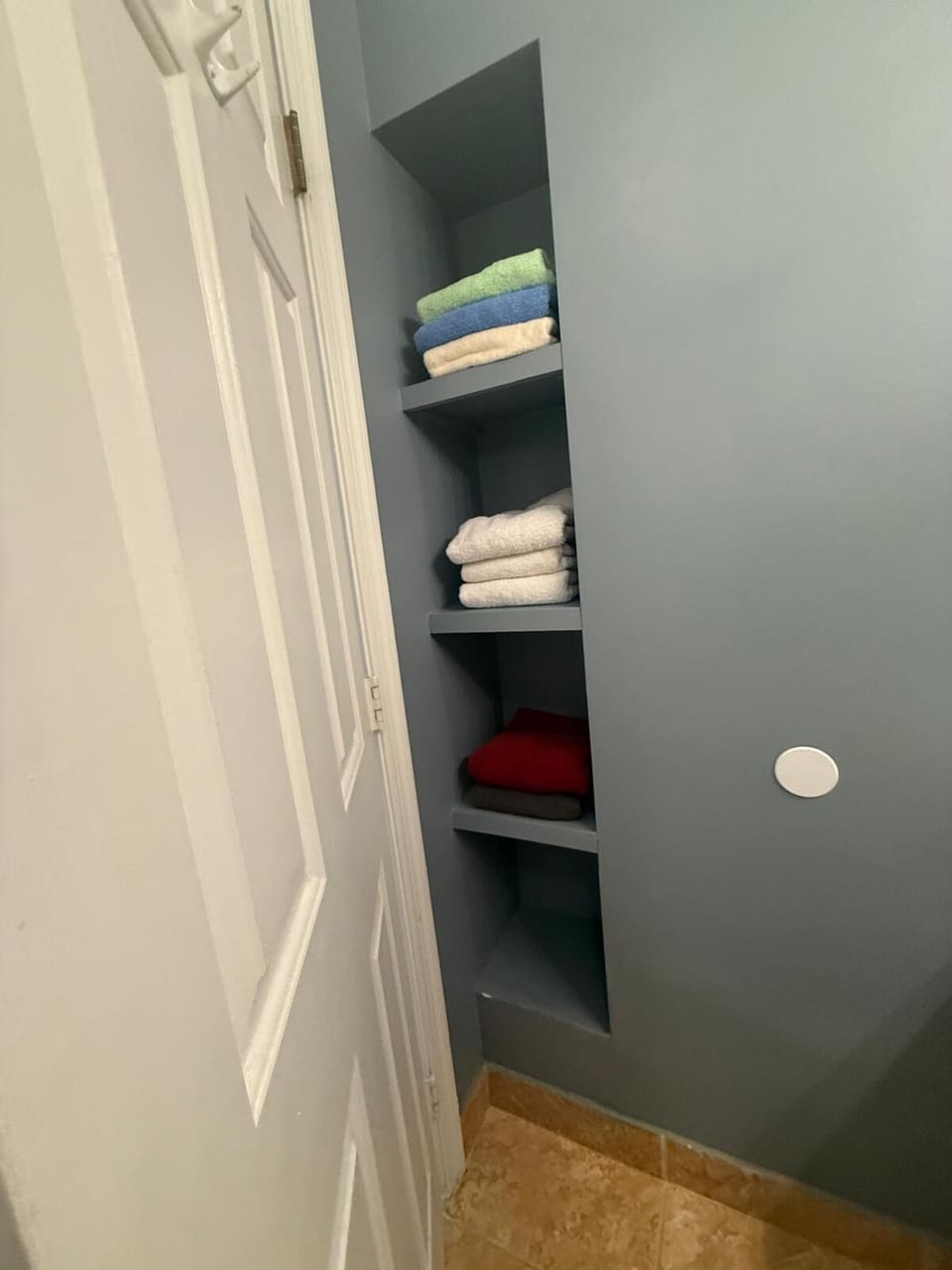 2nd floor bathroom with storage for towels