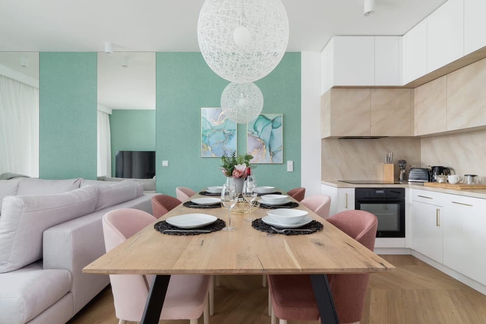 A seating area and fully equipped kitchenette with dining area.