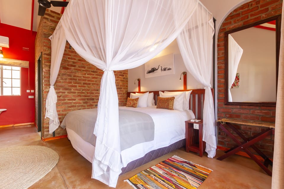 Deluxe Double or Twin Room, 1 Bedroom, Courtyard Area | In-room safe, individually decorated, individually furnished