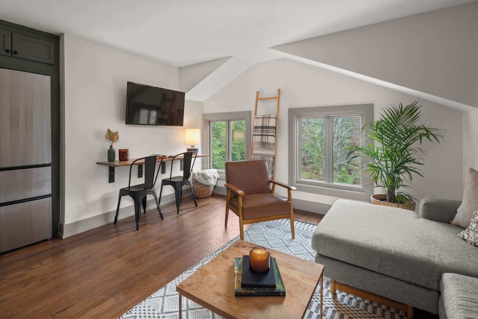 Open Concept Living Room | XL Flat Screen TV | Hardwood Floors | Third Floor
