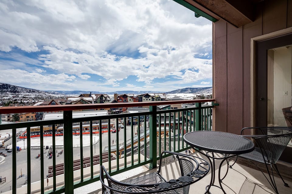 Step onto your private balcony and breathe in the crisp mountain air while enjoying stunning views of snow-capped peaks and the charming village below.