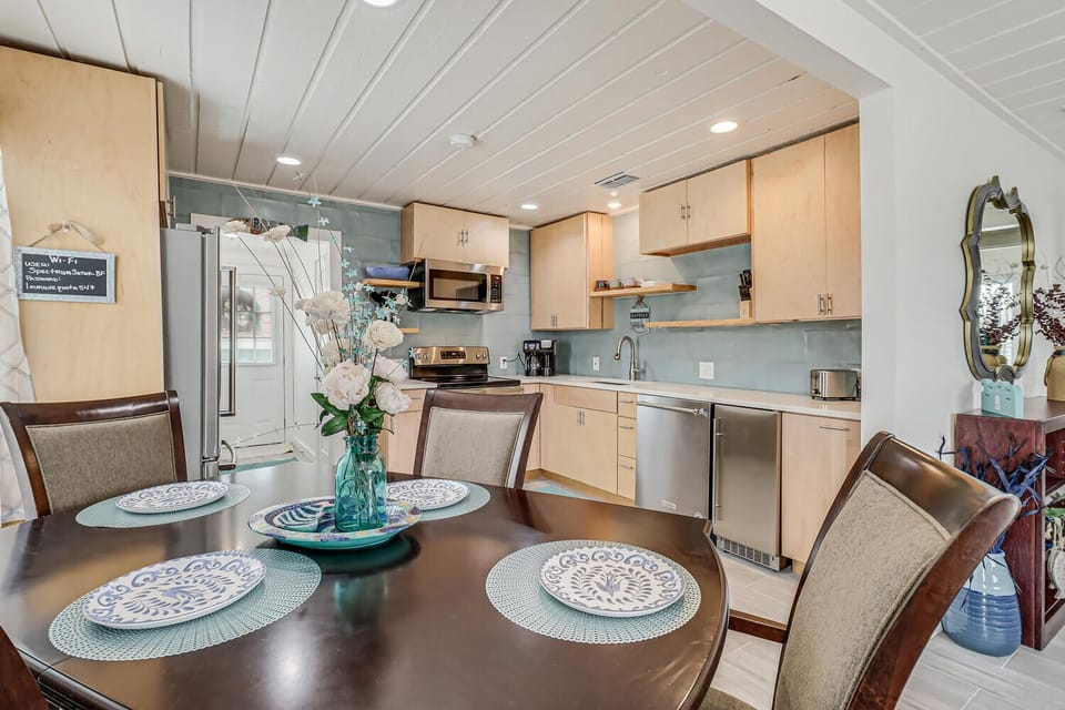 Step into your open-concept kitchen and dining space, where cooking becomes a joy with modern appliances and comfortable seating for memorable meals together.
