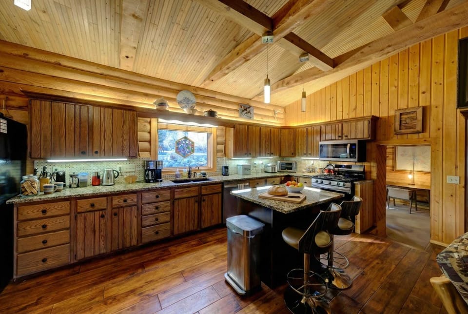 Fully equipped kitchen blends rustic charm with modern ease.