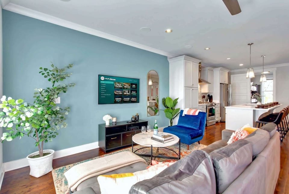 Welcome to your stylish Nashville retreat, where modern elegance meets comfort. This spacious vacation rental is perfect for large groups, offering an inviting living space with plush furniture. Unwind after exploring Music City and enjoy a night in with the latest entertainment.