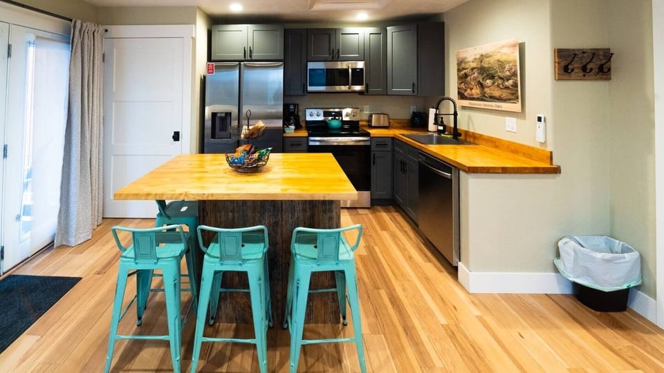 Full kitchen and dining island for those who want to cook a meal  instead of visiting one of the nearby restaurants in downtown Cody.