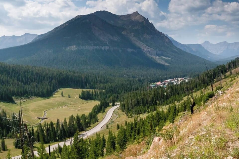 Most folks drive from Cody to Yellowstone's East Entrance at Pahaska. Insiders drive over the Chief Joseph Highway to Cooke City, MT (shown here) and enter through the Northeast Entrance in Silver Gate. Fewer lines and close to Lamar Valley!