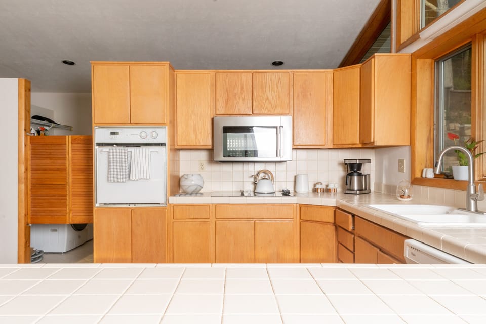 Fully stocked kitchen with electric stove and oven
