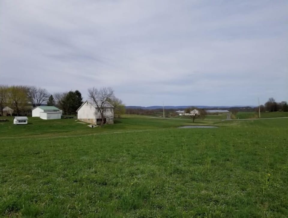 Lots of rolling fields around the farmhouse.