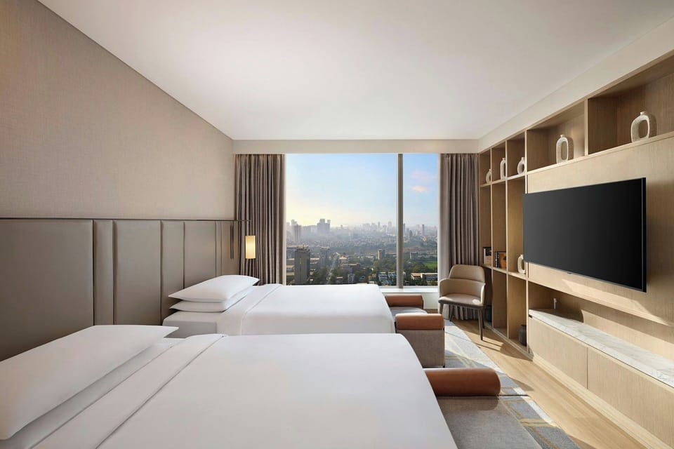 Premium bedding, down comforters, minibar, in-room safe