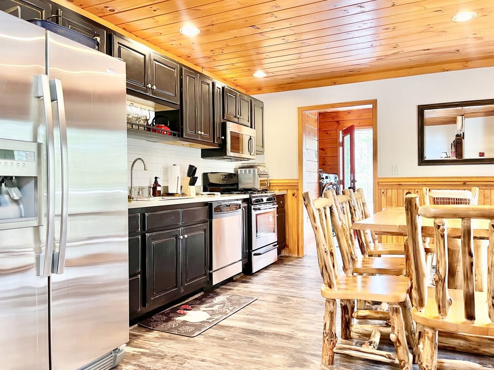 Gather around the kitchen table or dine al fresco on the huge front deck! 