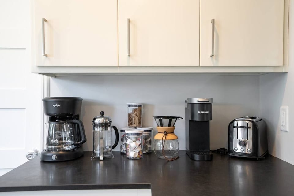 Coffee bar! However you prepare your morning beverage, we have you covered. French press, Keurig, pour over, and  drip coffee maker are all provided. Creamer, pods, sugar, and tea supplies are provided. 
