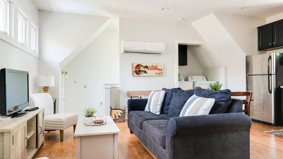 Sleek furnishings and elevated décor in this serene living room.