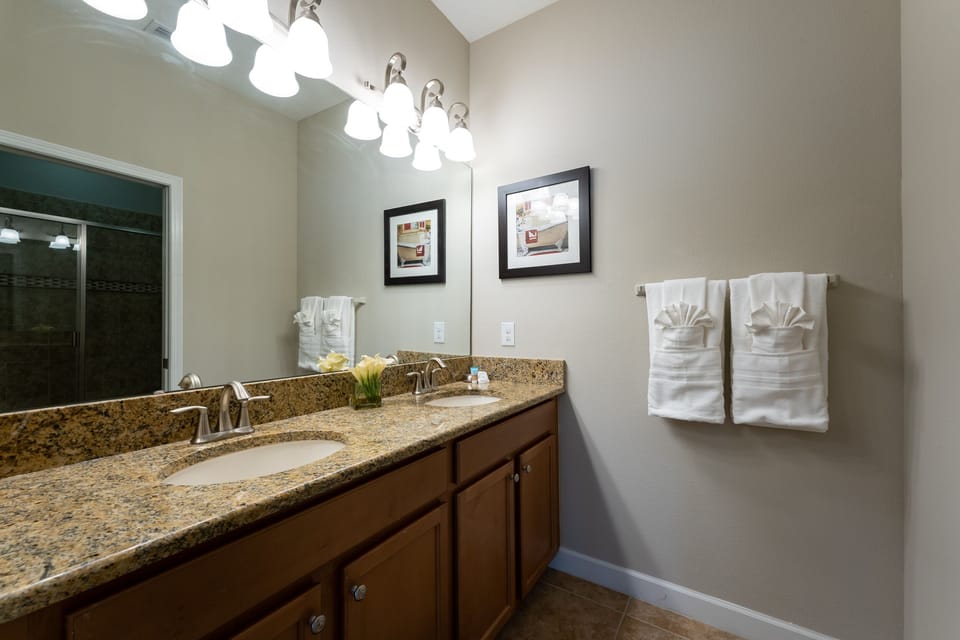 Downstairs bath with stand up shower and dual sink vanity
