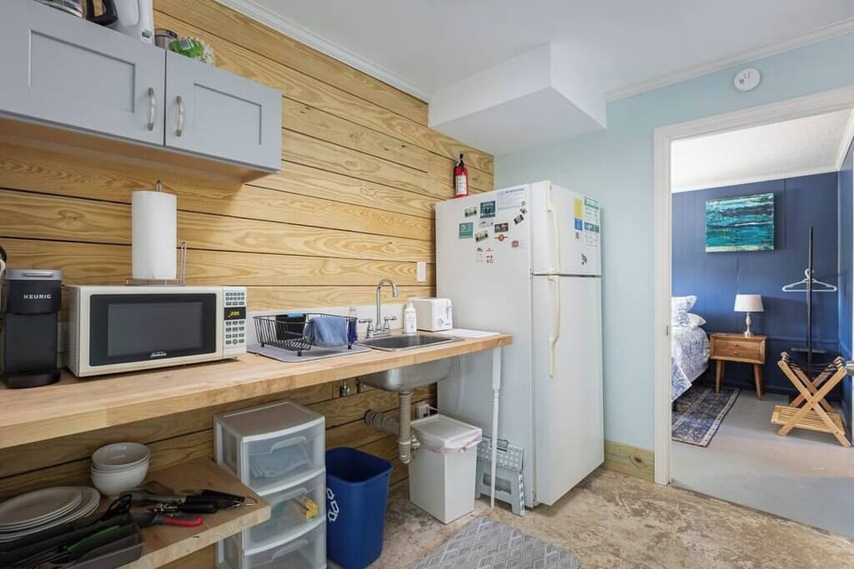 Lower Level Kitchenette with a Refrigerator, Microwave, Coffee Maker,Sink, and Counter Space or Preparing Snacks and Quick Meals 