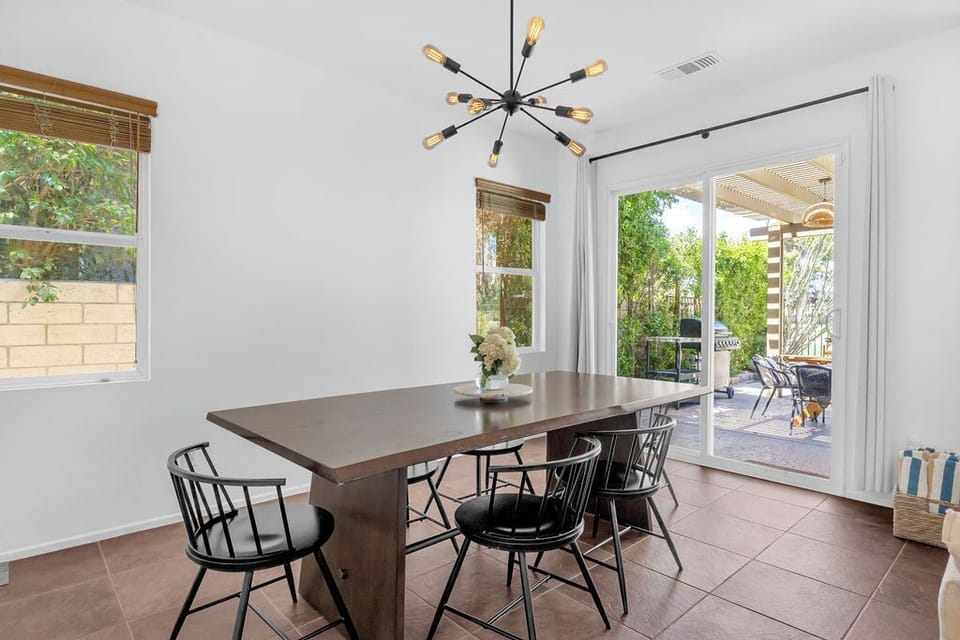 Dining area with entrance to patio