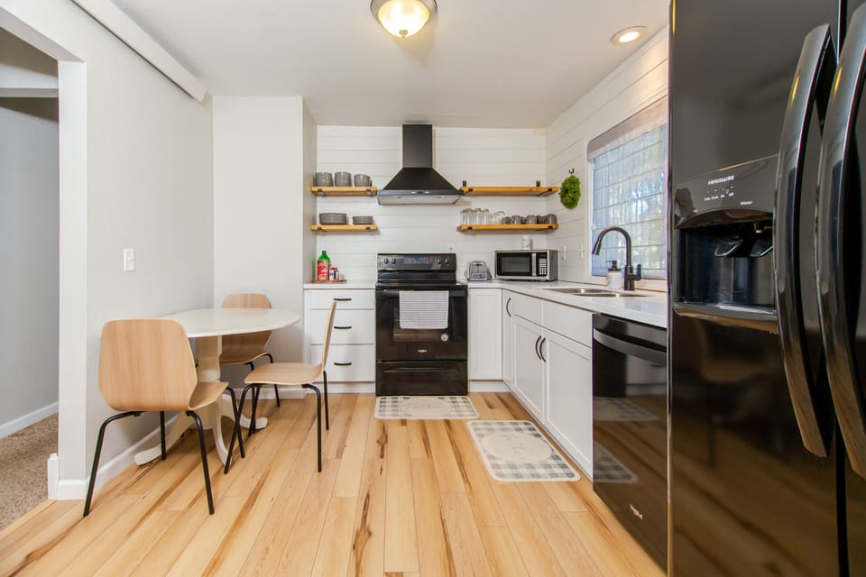Open, eat-in kitchen. Table extends to fit 4 comfortably.