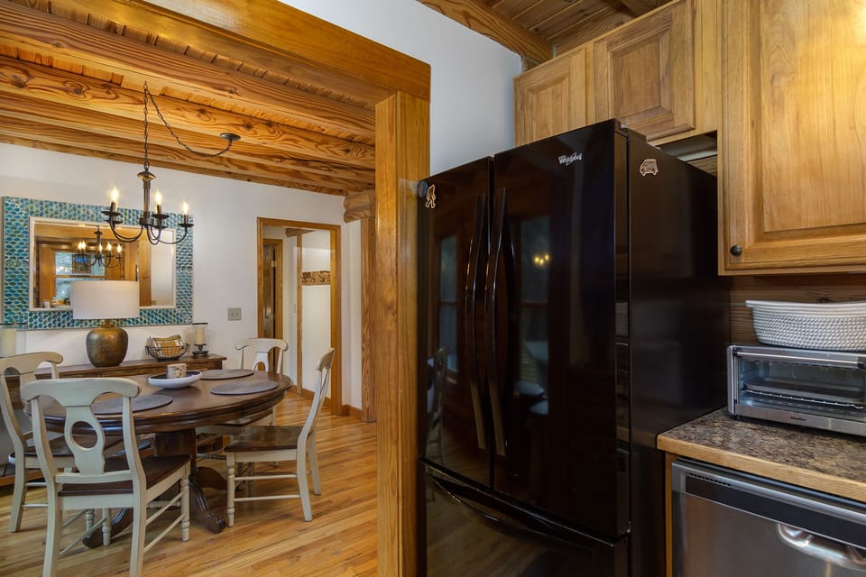 The dining area leads to the kitchen.