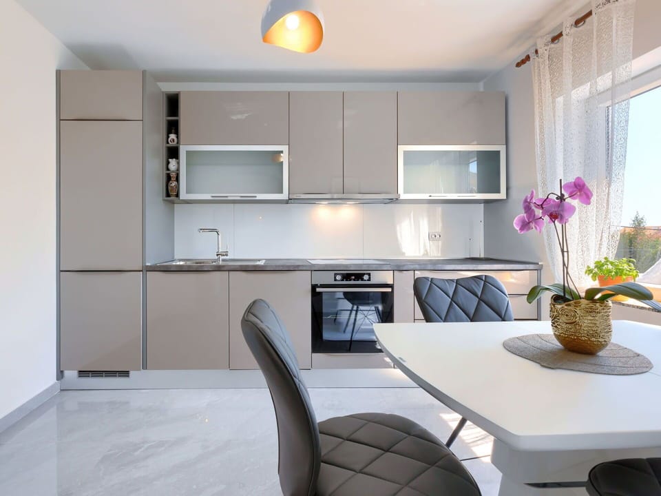 Cabinetry, Furniture, Plant, Countertop, Table, Interior Design, Lighting, Kitchen, Building, Kitchen Appliance