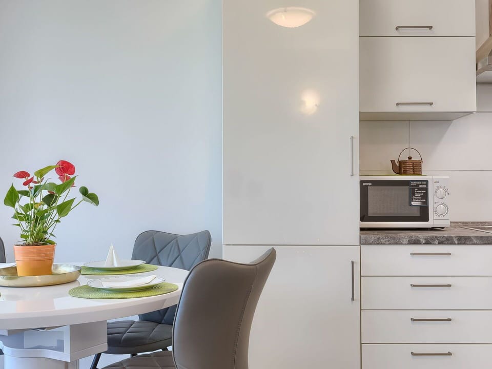 Furniture, Building, Property, Cabinetry, Plant, White, Table, Flower, Flowerpot, Chair