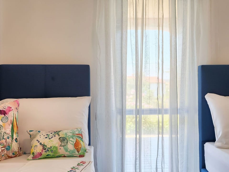 Furniture, Couch, Window, Comfort, Blue, Azure, Textile, Interior Design, Table, Pillow