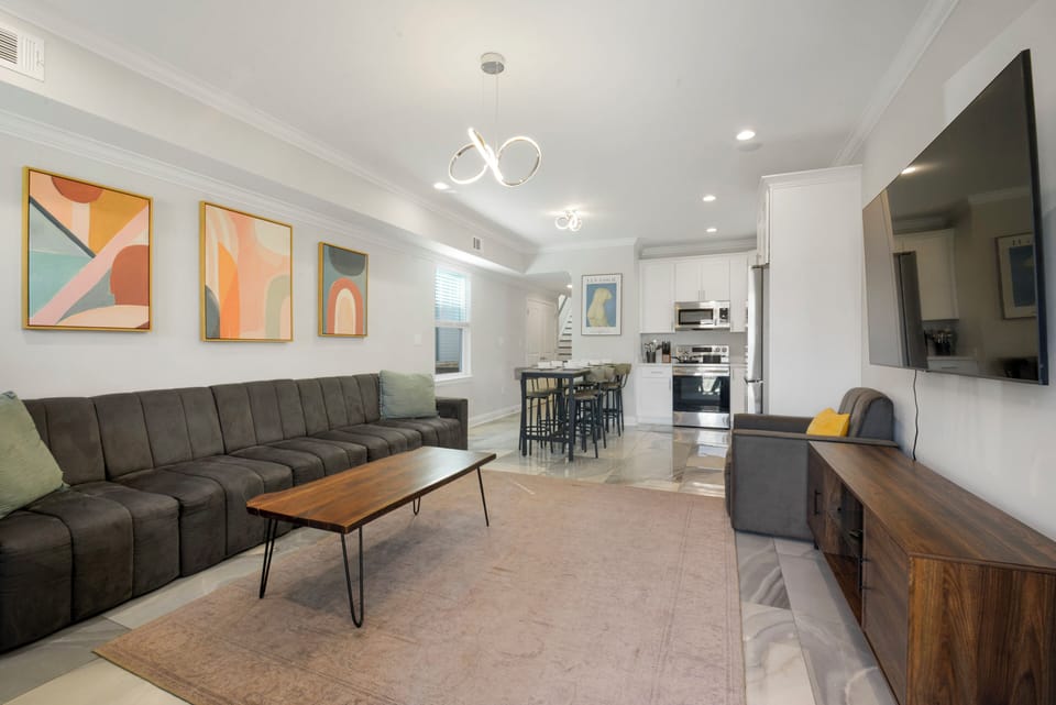 Living-  70 inch smart tv, ample seating, tons of light, carefully designed