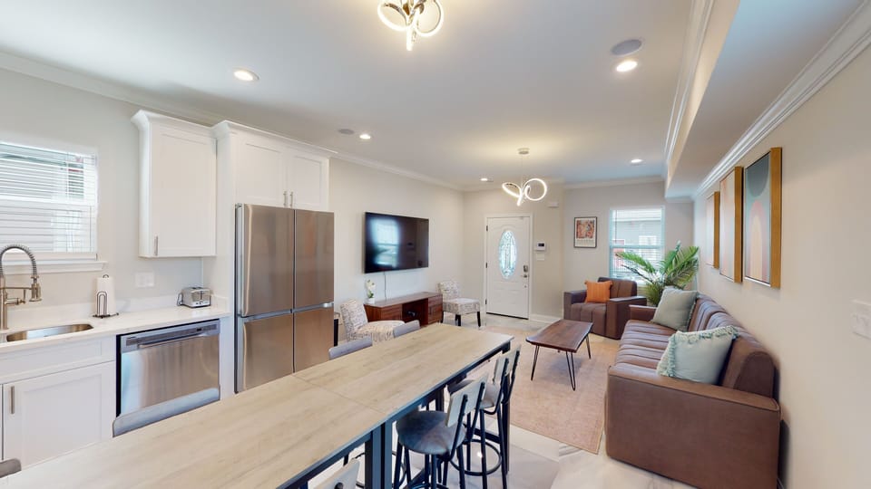 Living-  70 inch smart tv, ample seating, tons of light, carefully designed