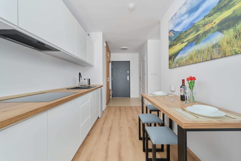 Fully equipped kitchenette with fridge and freezer, electric hob, electric kettle and microwave.