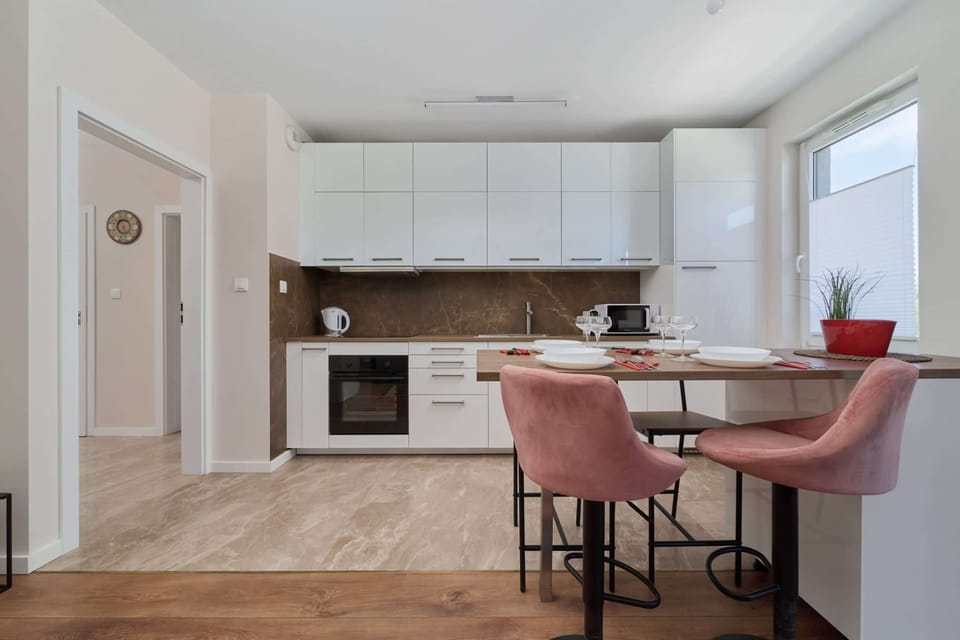 A stylish dining table with chairs, which is ideal for family meals or remote work.