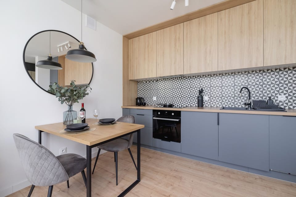 The sleek design of the kitchenette blending seamlessly with the living area.