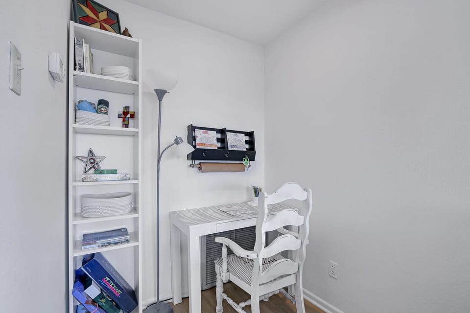 At the end of the room is a small work space.