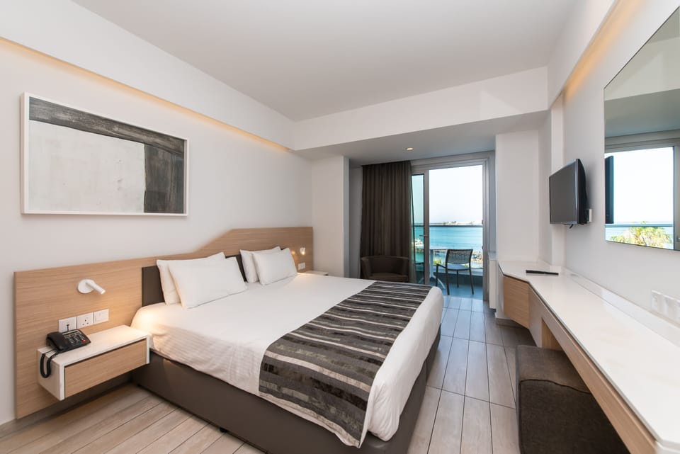 Double or Twin Room, Sea View | Minibar, in-room safe, desk, laptop workspace